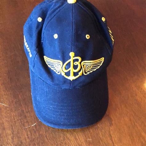 Breitling blue baseball style cap. Navy Blue with gold logo